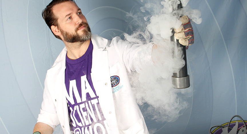 Mad scientist holding a tube with smoke surrounding it